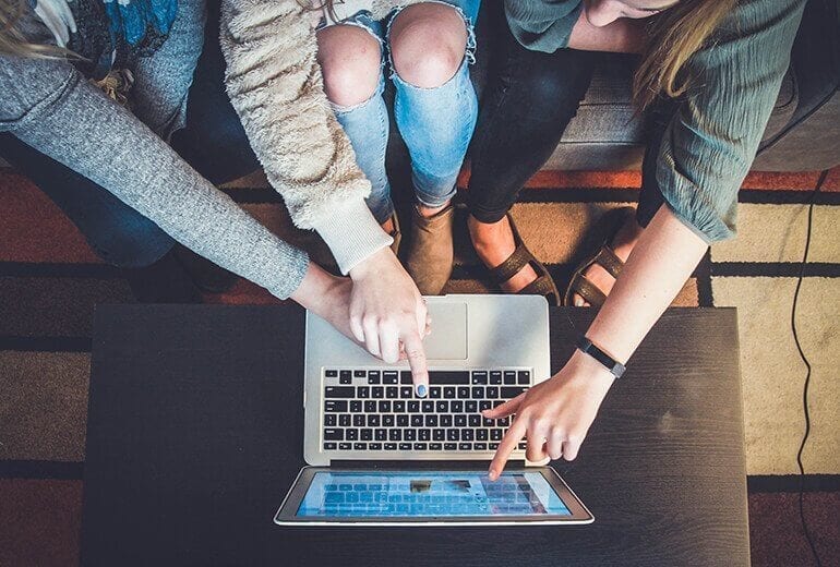 Group of women looking rehabs on a laptop