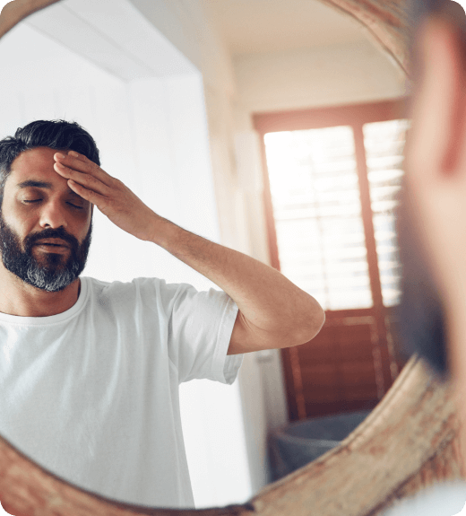 Man looking in a mirror