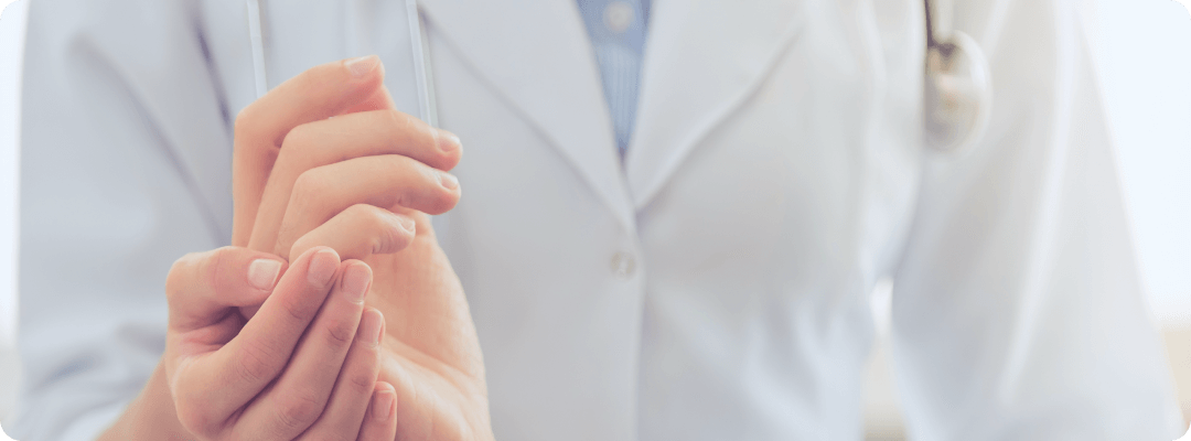 Nurse holding patient's hand