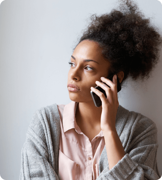 Woman talking on the phone looking afar