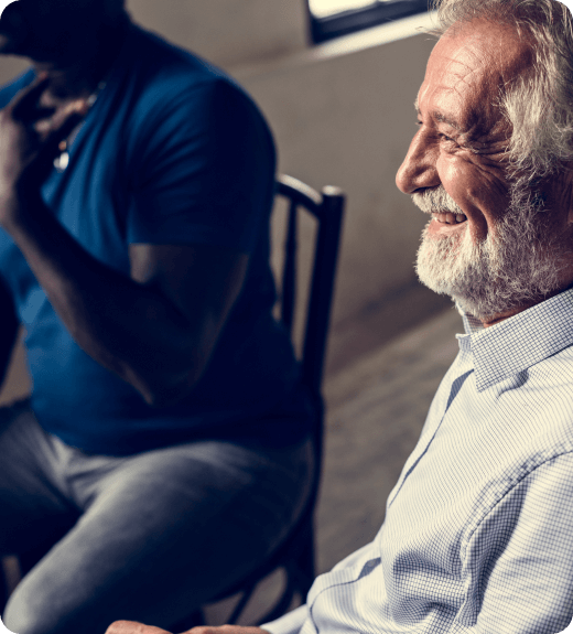 man happy discussing in group