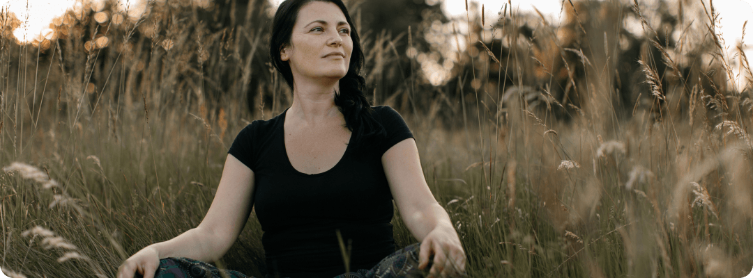 Woman meditating in the field